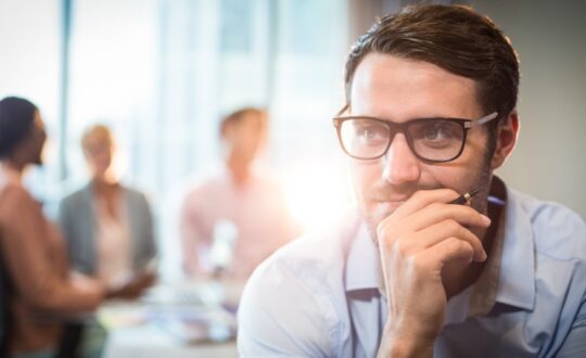 Thoughtful man with hand on chin